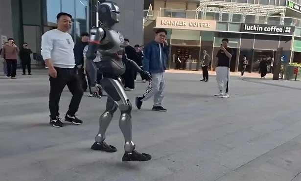 Inspired by "Iron Man," the PM01, launched by the Chinese company EngineAI Robotics, uses an AI neural network and impressed viewers in a video with its human-like walk.